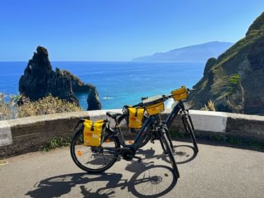 Two bikes on the cycle path with the Atlantic Ocean in the background