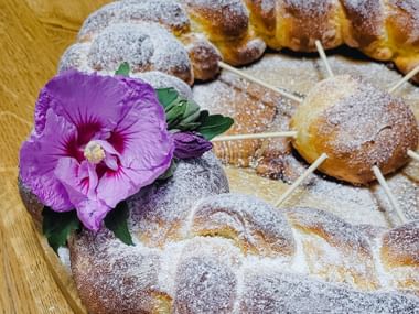 All Saints' Striezel with floral decoration and sugar