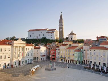 Piran's Tartini Square with its historic houses and the church in the background