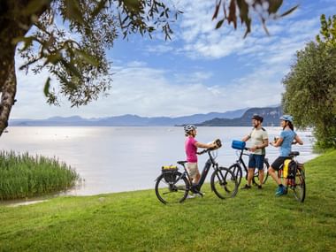 Cyclists on the shores of Lake Garda near Bardolino