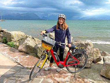 Cyclist on the shore of Lake Garda