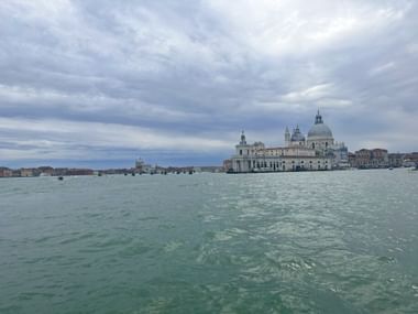 View from a waterbus in Venice overlooking the sea and the cathedral.