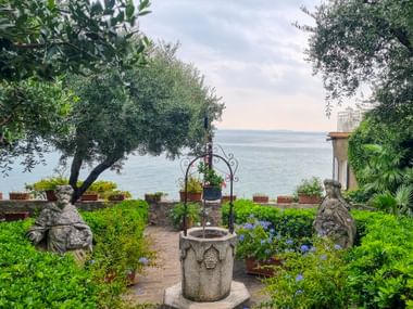 View of Lake Garda from Sirmione from a picturesque garden