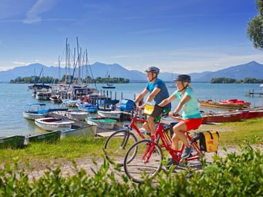Biker along the Lake Chiemsee Biker along the Lake Chiemsee
