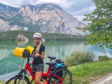 Cyclist in front of the Lago di Cavedine