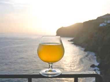 A glass of poncha at sunset