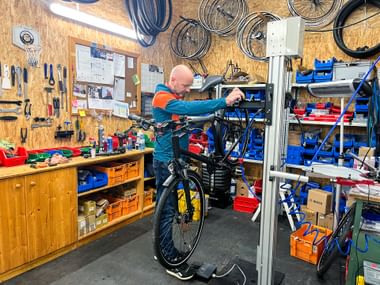 Man servicing a bicycle