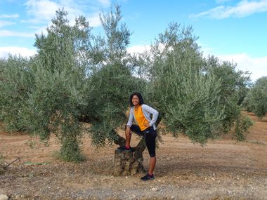 Fatima next to an olive tree