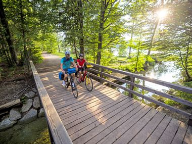 Cyclist on bridge at Munich lakes