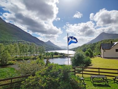 Fjord flag in front of a lake in Kinlochleven
