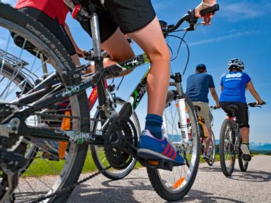 Cyclists cycle along the Inn cycle path