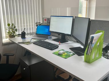 Grey height-adjustable desks
