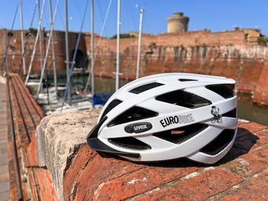 Eurobike bicycle helmet on a brick wall at the port of Livorno