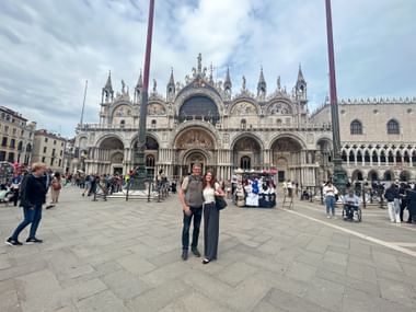 Father and daughter arriving at St. Mark's Square in Venice.