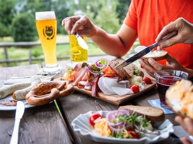 Snack with bread, white sausages, pretzels, Obazda and beer