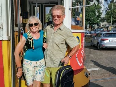 Cyclists in front of the Remodelado tram in Lisbon
