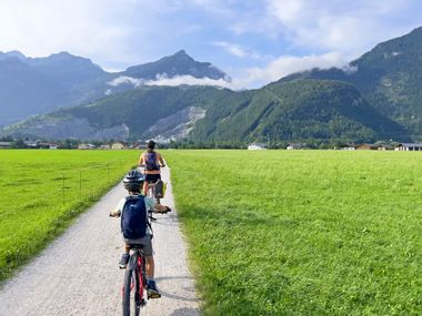 Family on a cycle path through the Salzburg mountains