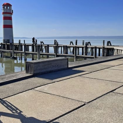 Lighthouse in Podersdorf on Lake Neusiedl with bicycle in the foreground