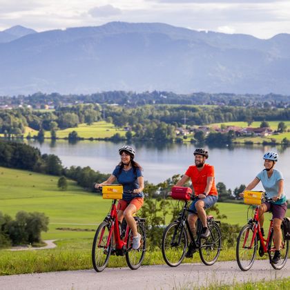 Cyclists with a view of Lake Riegsee