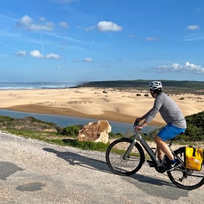 A cyclist enjoys the view of the Costa de Santo Andre