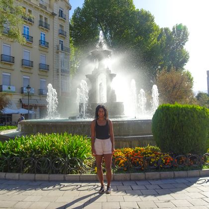 Fatima in front of a fountain in Granada