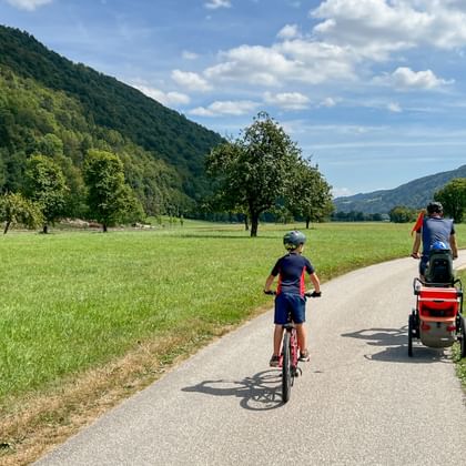 Family at Lech-cycle path along landscape