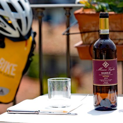 Red wine; Eurobike saddlebag and bike helmet in the background