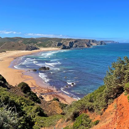 View of the sandy beach and the rocky bay of Bordeira