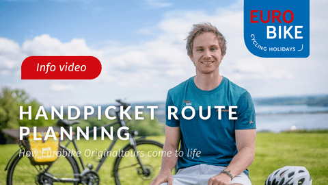 Young man in blue shirt sitting outdoors with bicycle and helmet. Text reads 'Handpicked Route Planning' with Eurobike logo and 'Info video' label.