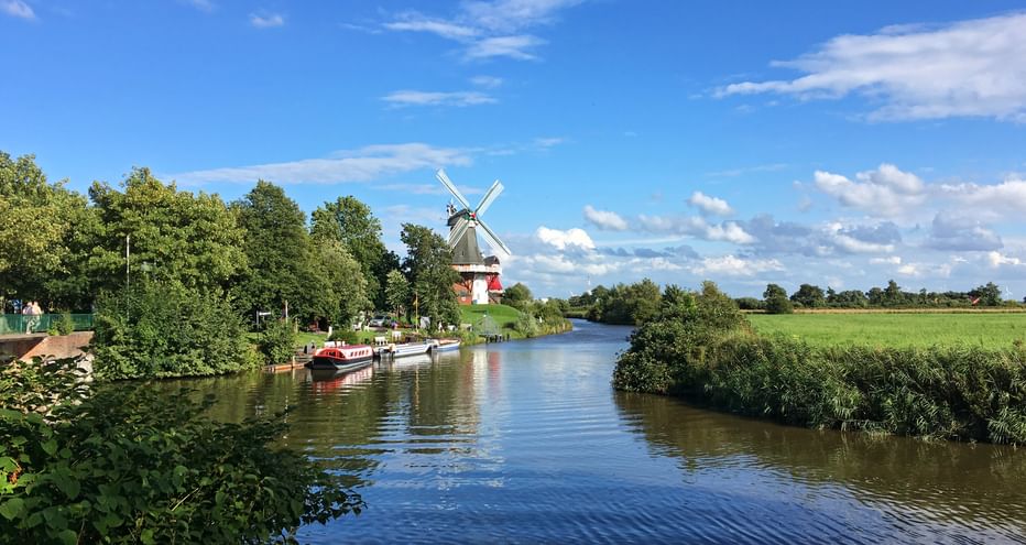 Old Greetsiel sieltief with a windmill in the background