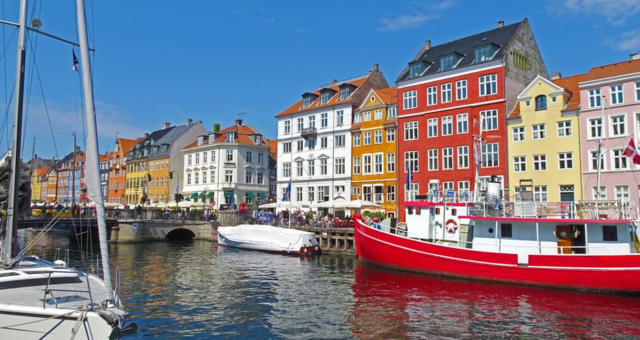 Boats and colourful houses in Nyhavn in Copenhagen