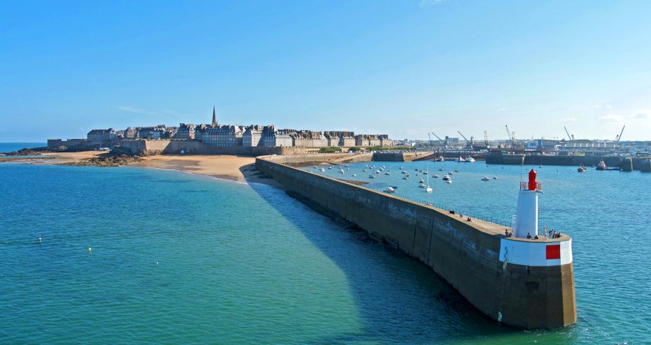 View of the long breakwater of the walled city of St Malo by the sea