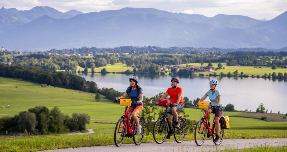 Cyclists with a view of Lake Riegsee