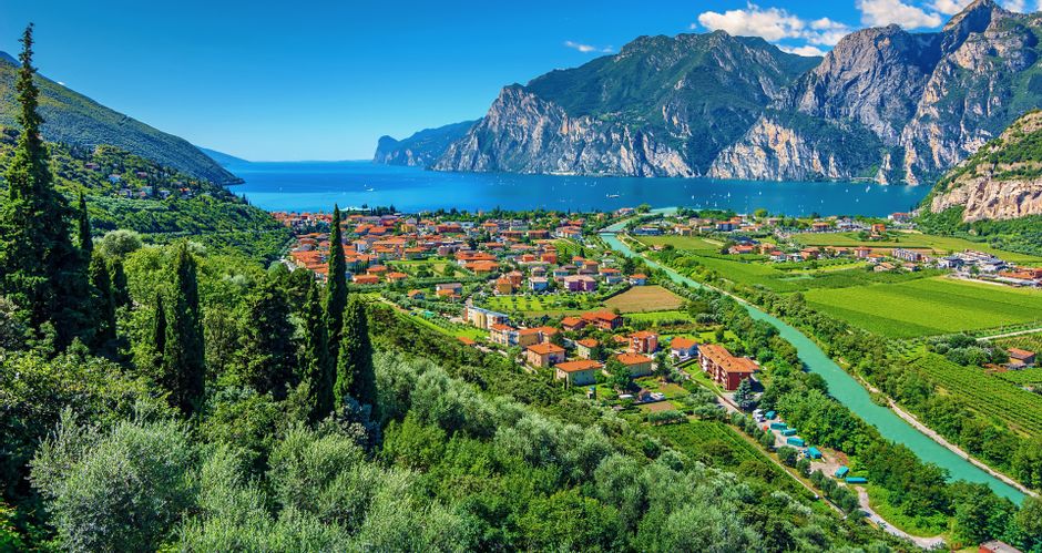 View of the town of Torbole on Lake Garda with mountain panorama