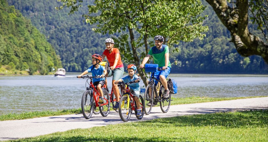 Family on the cycle path on the banks of the Danube