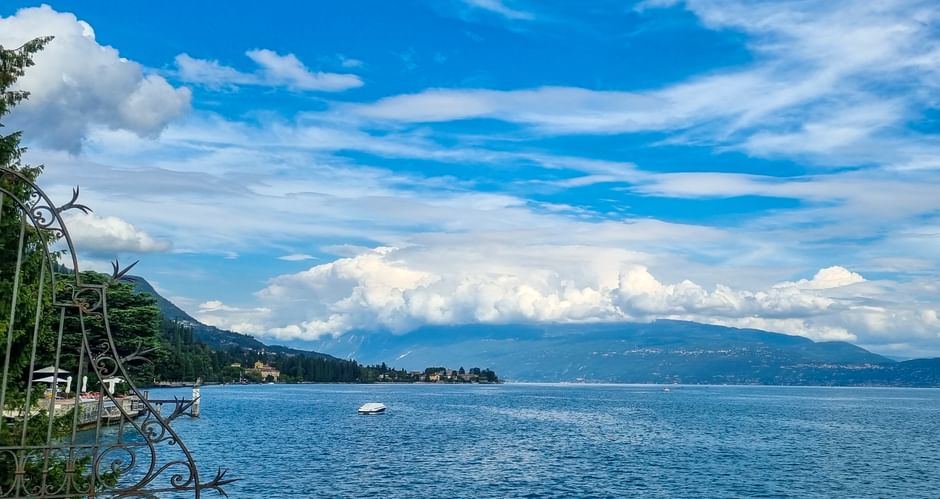 View of the blue Lake Garda under a blue sky
